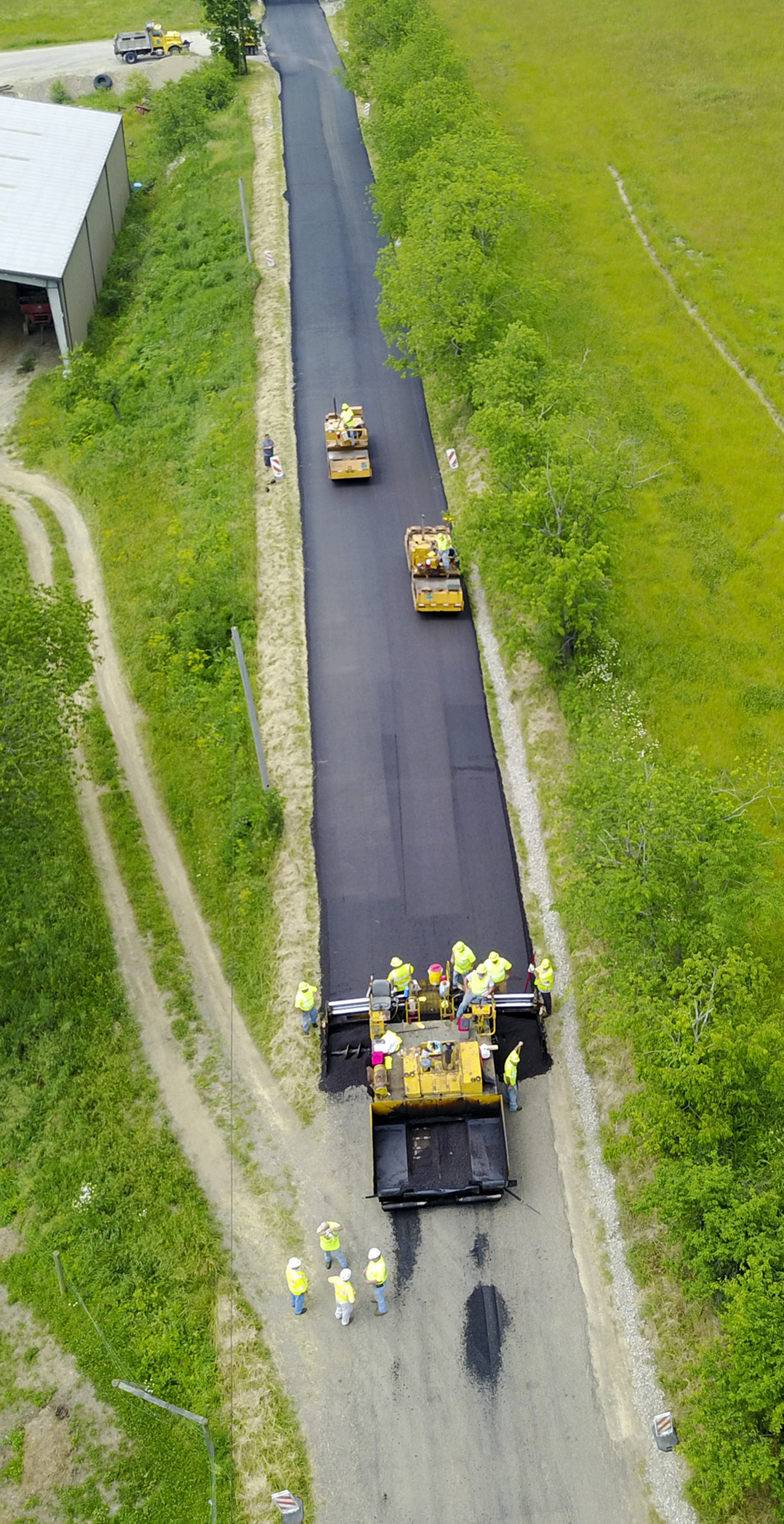 Road crews apply recycled asphalt pavement in Armstrong County.