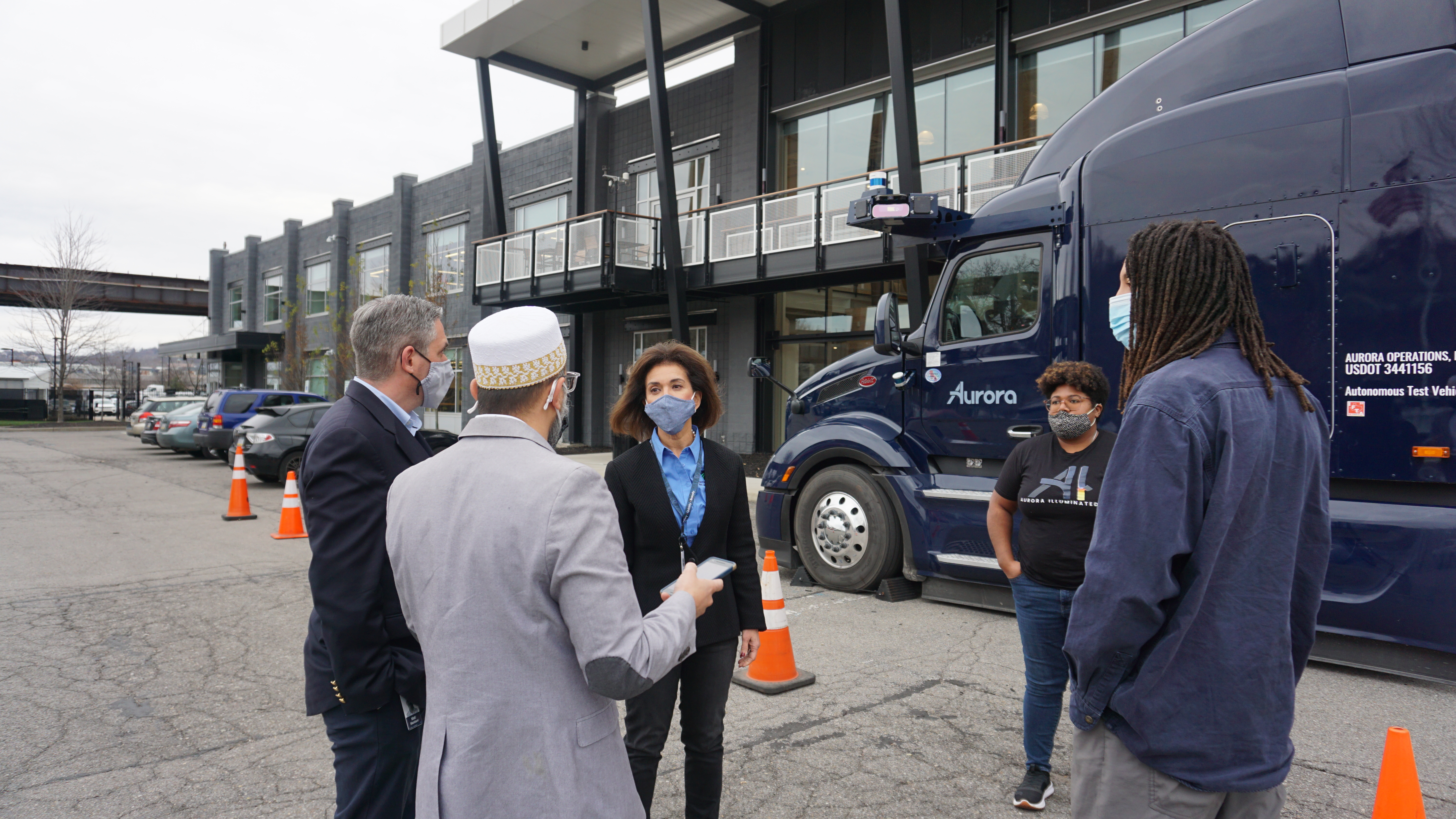 Secretary Gramian discusses autonomous trucking technology with staff at Aurora.