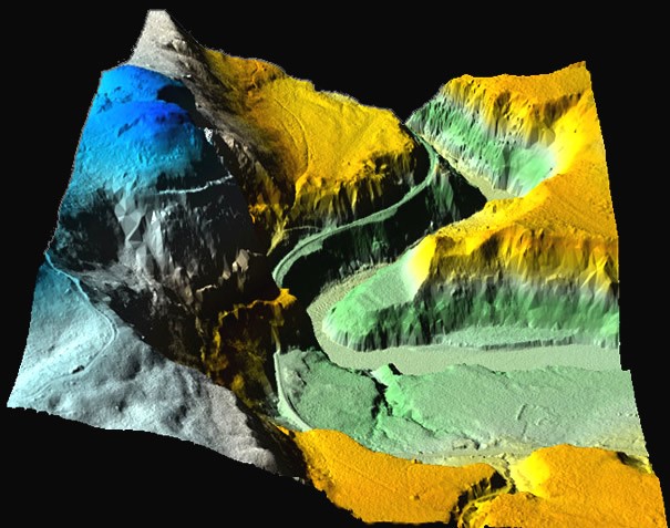 3-d model of a hilly terrain with colorful points 