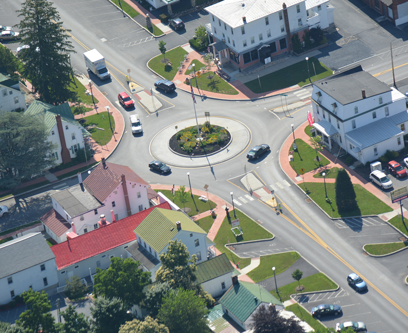 Traffic flow in a roundabout at a busy intersection.