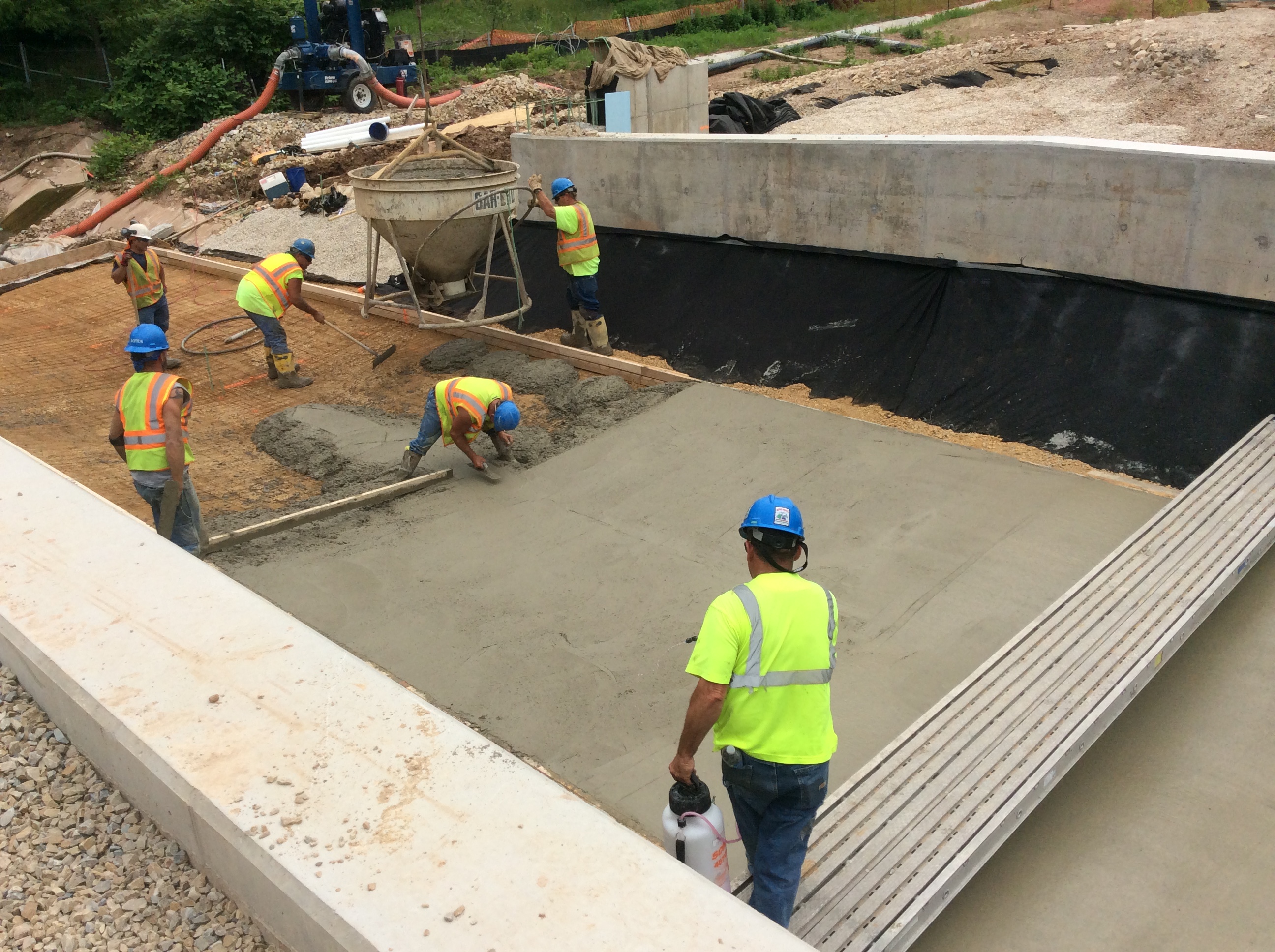 Construction workers placing concrete on Accelerated Bridge Construction project
