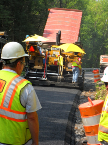 Safety edge being implemented as part of a roadway construction project
