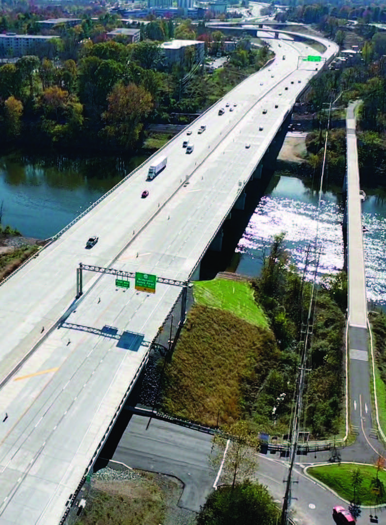 A six-lane highway travels across a river.