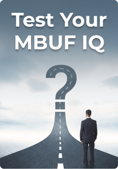 Man in a suit looking at a road that swoops up to look like a question mark. Test Your MBUF IQ is the title at the top of the image.